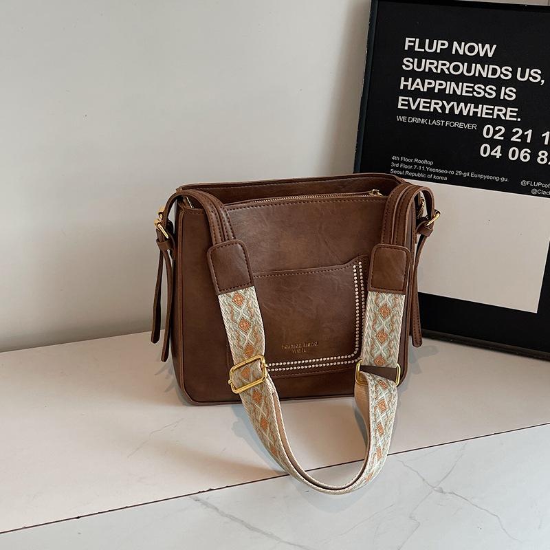 

Retro broadband bag bucket bag women s new niche simple retro Maillard shoulder oblique span bag коричневый