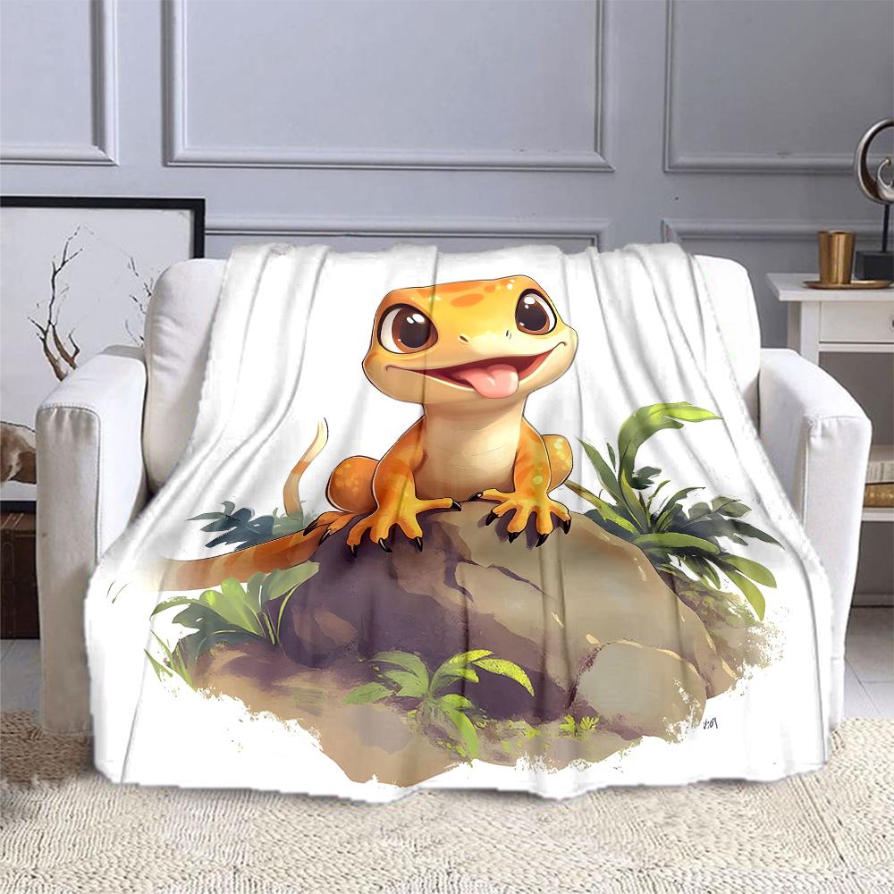 Cute Gecko Smiling on a Rock Patterned flannel blanket perfect for the bedroom living room, sofa, or a little nap