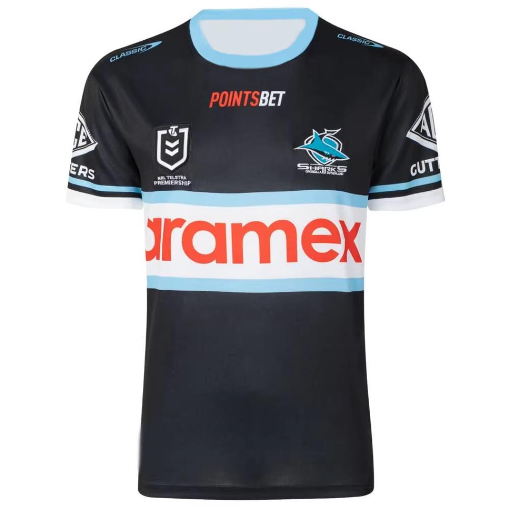 Nové horké prodávané podepsané 2025 Cronulla Sharks NRL Rugby League dres - Důkaz COA - 26 podpisů Děti Dospělí Rychleschnoucí tričko Top