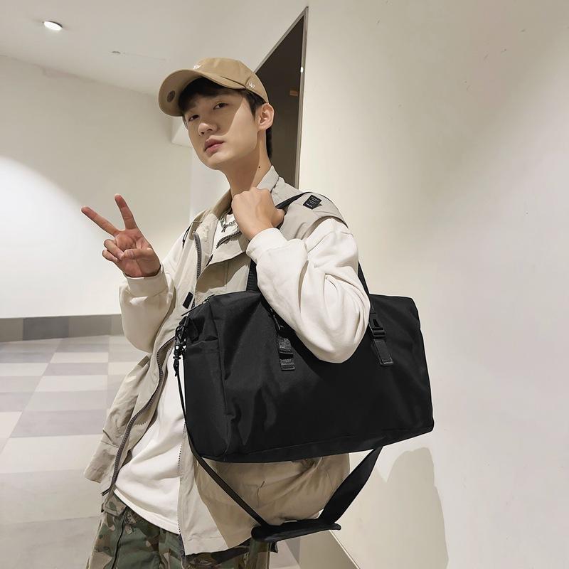 Korean version travel bag portable large-capacity short-distance travel bag sports luggage bag fitness bag shoulder messenger bag men and women
