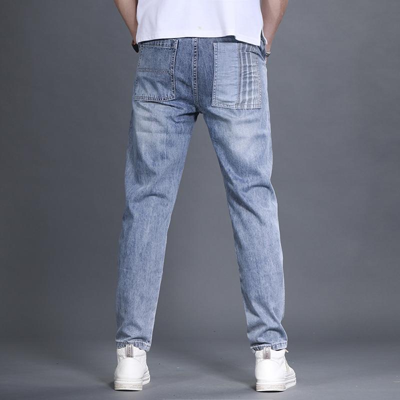 Pantaloni da uomo Patchwork Splicing Denim Primavera e Autunno Piedi Piccoli Tendenza Hip-hop Casual Versatili Taglie Forti