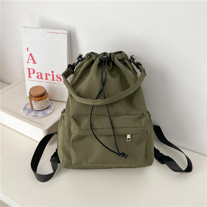 Daily versatile student schoolbag new niche design drawstring bundle shoulder bag simple commuter backpack women