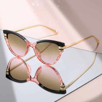 Fashion Cat Eye Sunglasses with Black Top Frame, Red Patterned Lower Frame, Gold Metal Arms, and Gradient Brown Lenses For