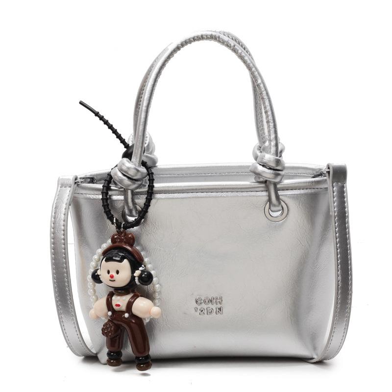 2025 new Korean simple oil wax leather portable bucket bag fashionable versatile solid color foreign style commuter messenger women's bag