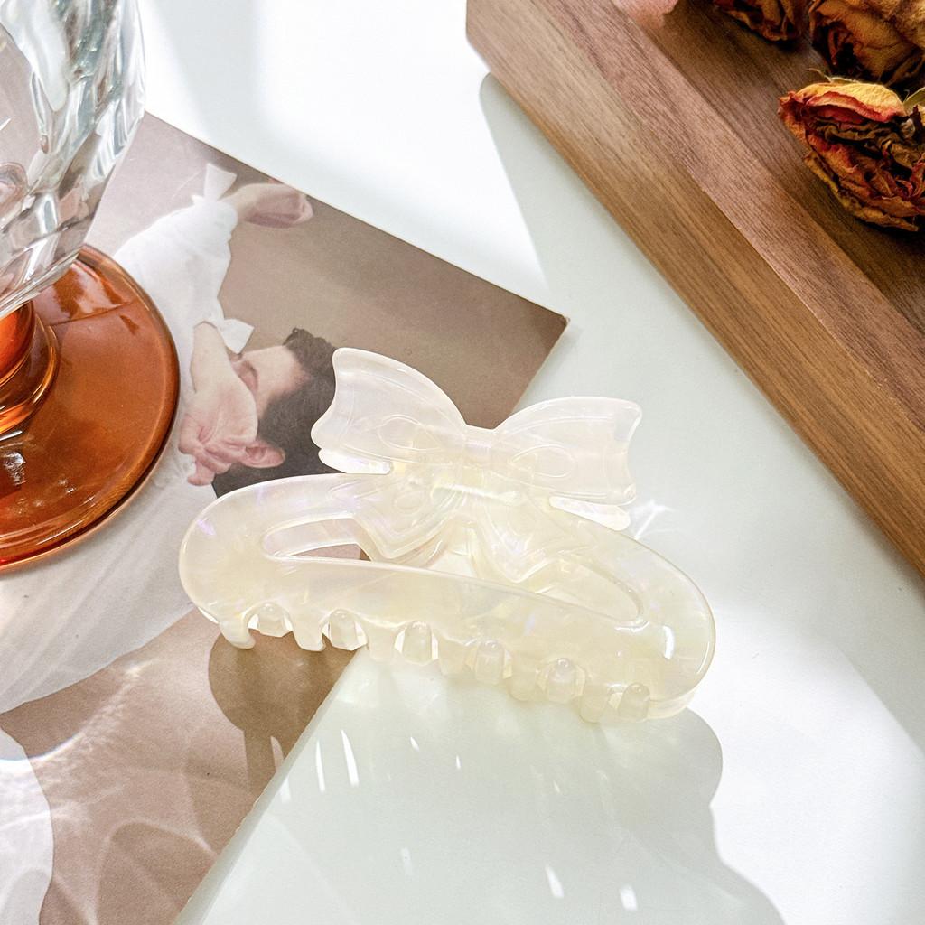 Beautifully Crafted Acetate Hair Claw With Trendy Bowknot For Fashionable Ladies Shimmer White