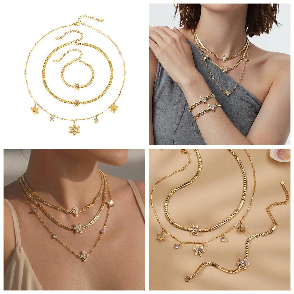 Exquisite 18k Gold-Plated Zircon Flower Jewelry Set: Stackable Stainless Steel Bracelet and Necklace.