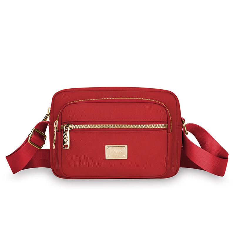 New Portable Oxford Cloth Mother Bag Fashion Simple Multi Layer Middle Aged Shoulder Bag Atmosphere Joker Slung Small Bag.