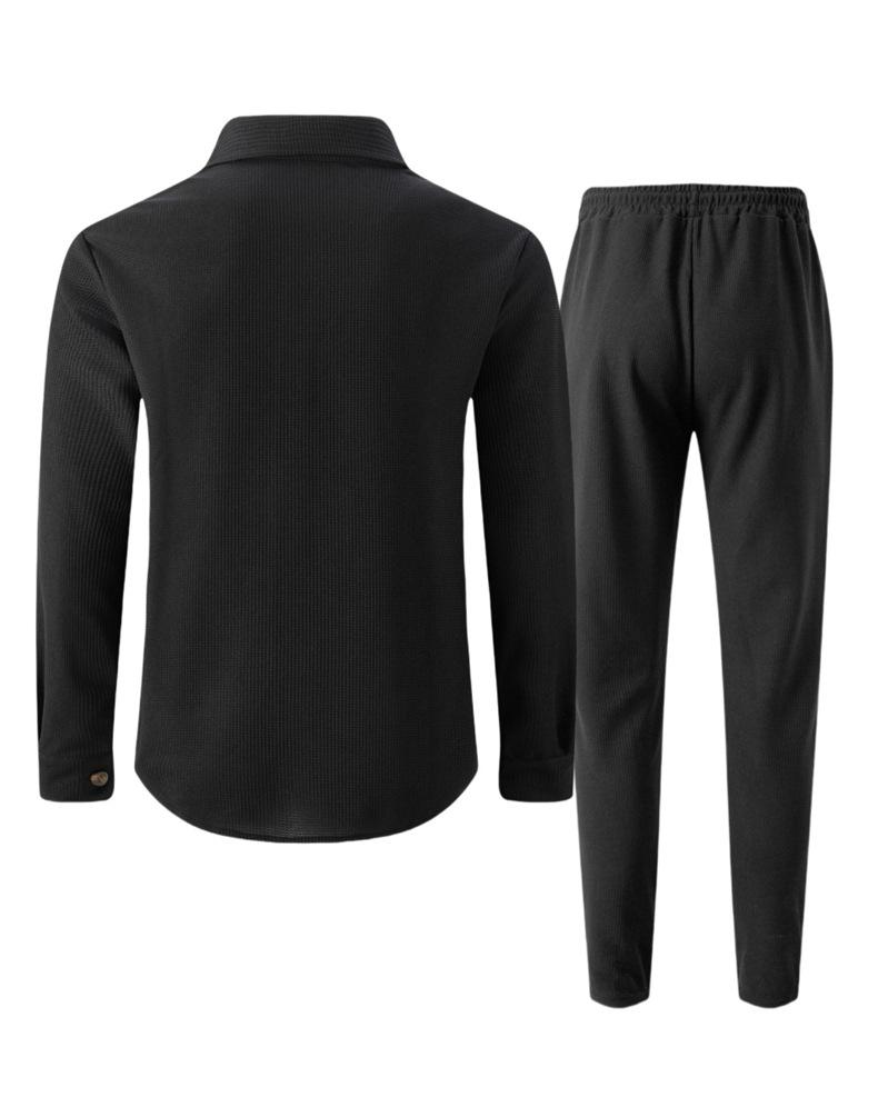 Completo casual da uomo autunnale europeo con giacca a maniche lunghe a nido d'ape e pantaloni