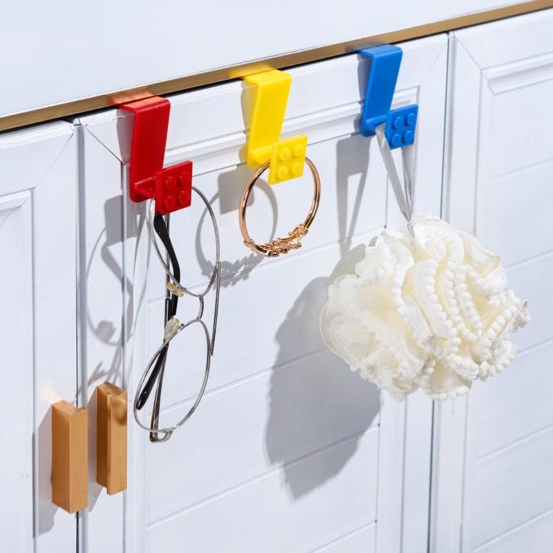 Baustein Cartoon Haken zum Aufhängen von Müllbeuteln Plastiktüten an Schranktüren Einfache Installation Heimküchenorganisation Mehrzweck-Nutzhänger