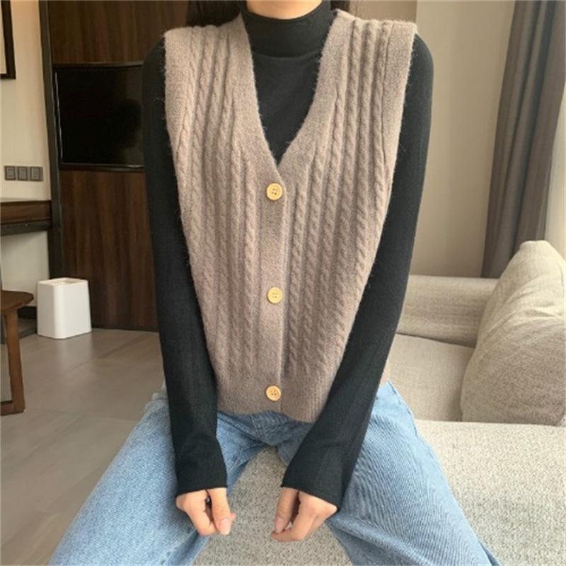 Knitted Vest, Short Top, Sleeveless Sweater Worn On Top A Small Woman with A Cardigan and A Camisole Shoulder