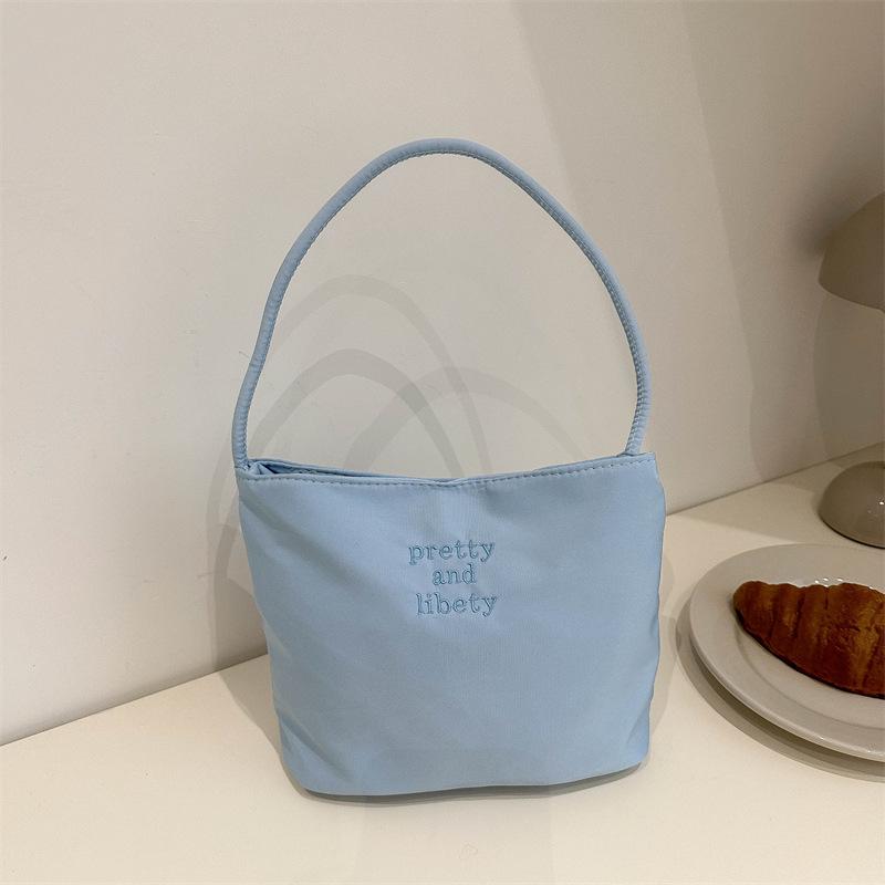 Modna torebka na ramię w kolorze cukierkowym na rok 2024: Stylowa codzienna torebka typu bucket pod ramię dla kobiet
