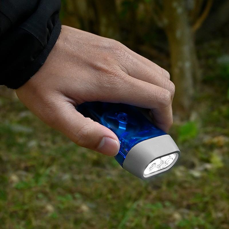 Sell Outdoor Led Manual Pressure Generator Crank Flashlight No Battery Flashlight Camping Light Lamp Emergency Survival Tool