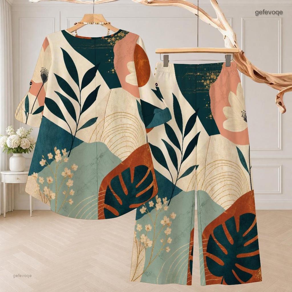 Women Plus Size White Printed Two Piece Set Round Neck Half Sleeve High Low Top Wide Leg Pants