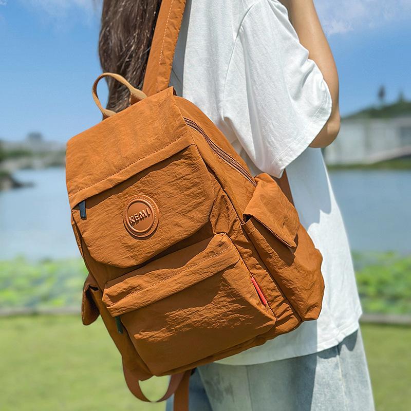 New Japanese outdoor lightweight fashion schoolbag backpack small backpack women's simple and versatile new travel schoolbag women