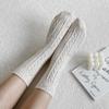 Knitted mid-length socks with a twist ac-9589c