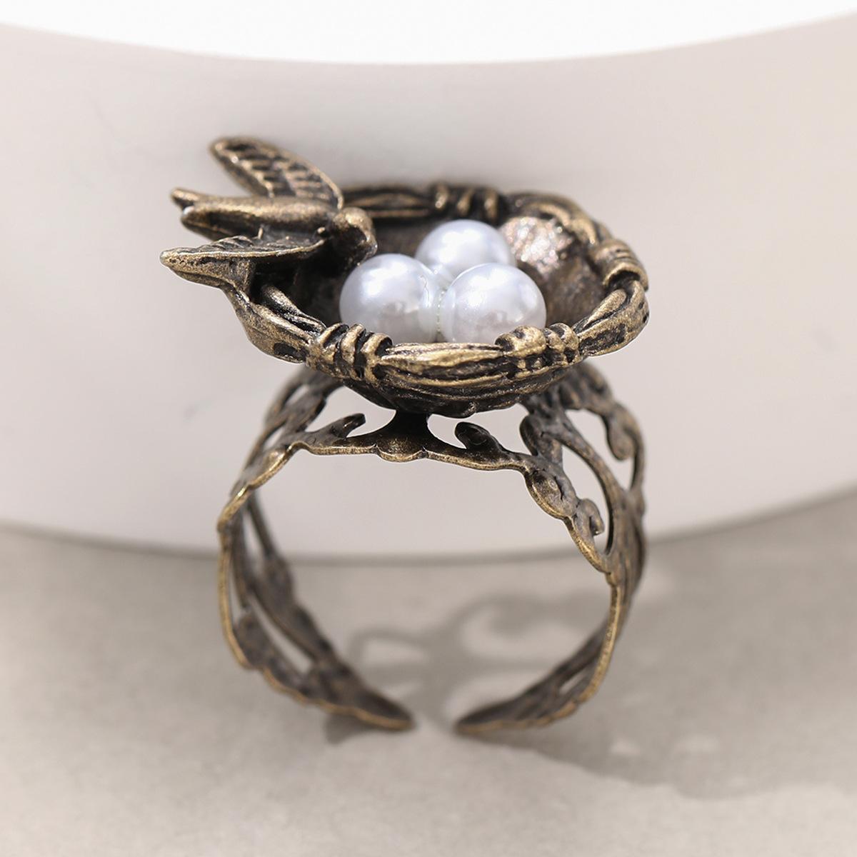 

Creative Retro Sliver Color Hollow Out Ring Face Bird s Nest Pearl Bird Eggs Adjustable Opening Rings for Women Fashion Jewelry resizable