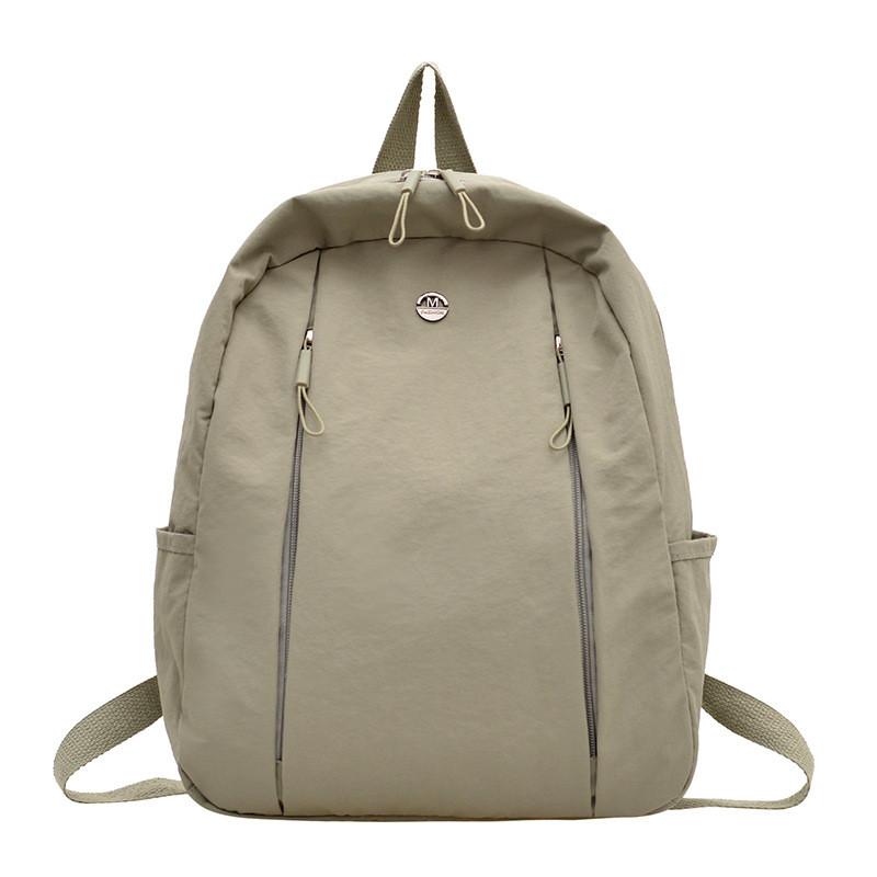 Lightweight Nylon Backpack For Commuting And Travel Withsmall Golden Roundel Decoration
