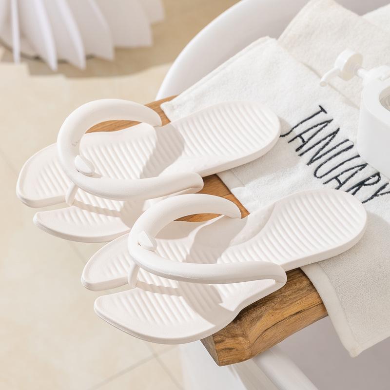 Spring and summer new product portable couple flip-flops women's home simple solid color beach travel hotel cool slippers