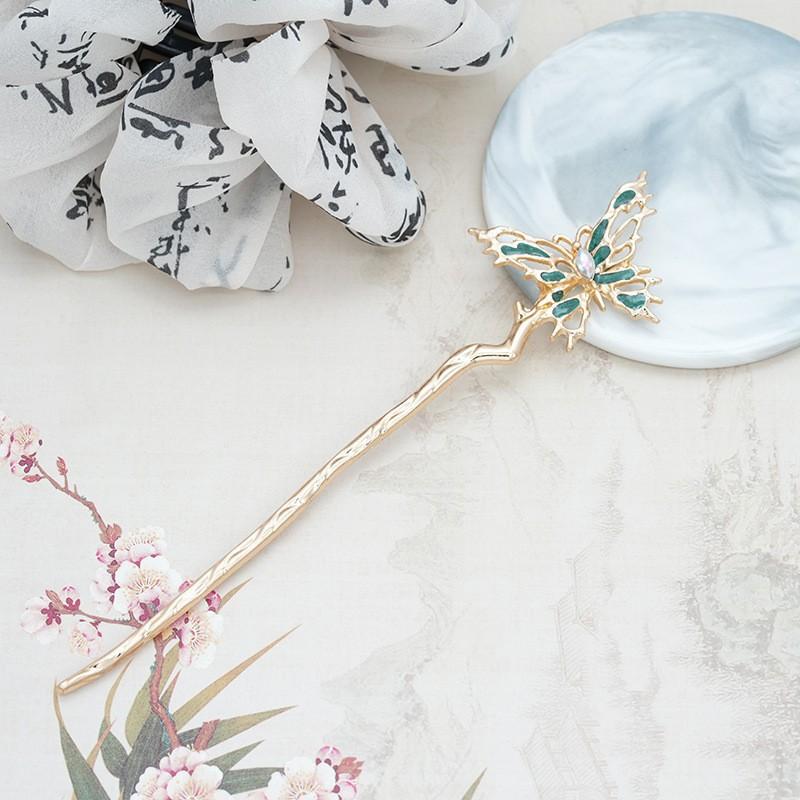 

Alloy Electrophoresis Color Retention Irregular Hollow Drop Oil Embedded Diamond Butterfly Disc Hair Hairpin New Chinese Light Luxury Niche Hairpin