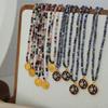 European-American Niche: Blue Spirit Grey Natural Stone Handmade Necklace with Starry Sky Glaze Angel Pendant In Gold-Plated Titanium Steel.
