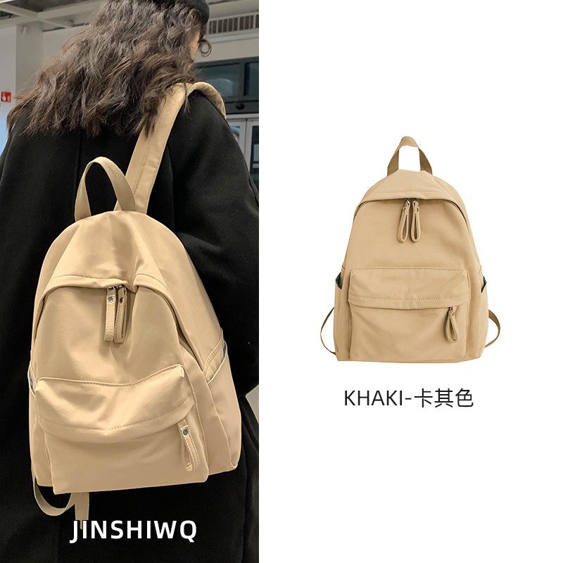 School bag female college student 2025 new simple and lightweight travel bag large capacity backpack junior high school girls backpack male
