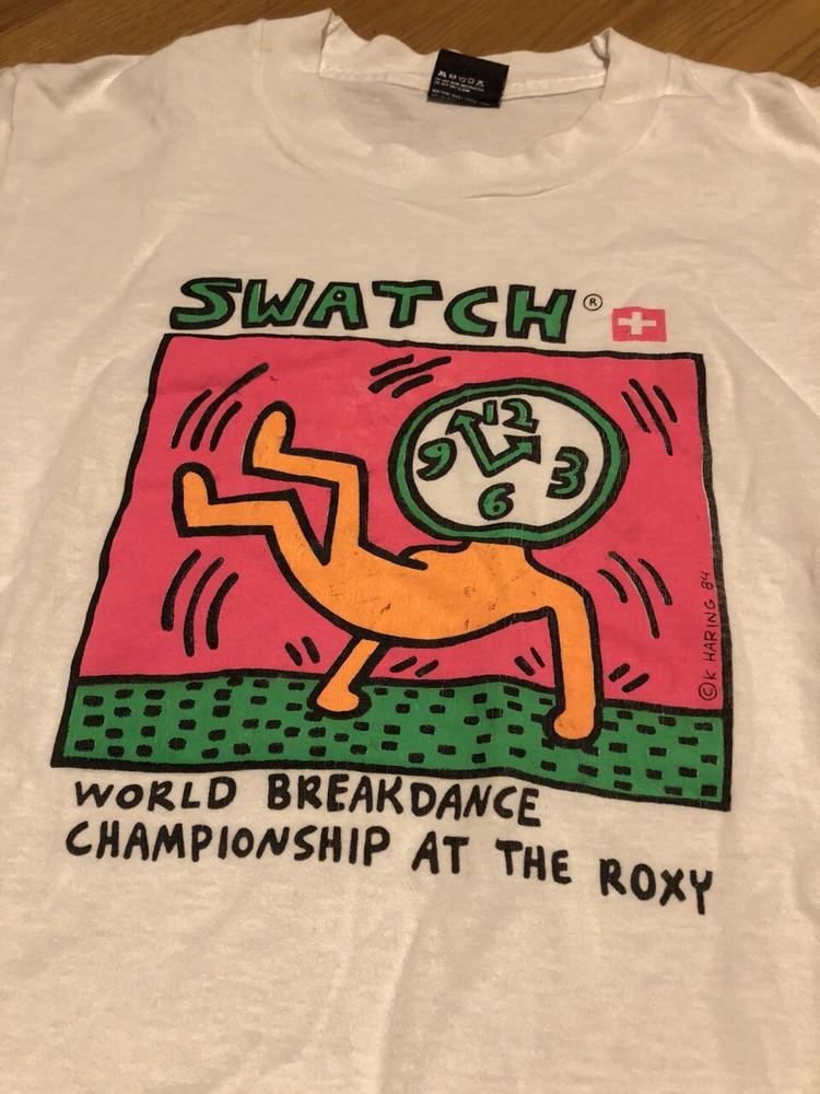 

Кіт Герінг Swatch World White Унісекс S-5XL Чоловіки Жінки VM9324 Унісекс Футболка XXL