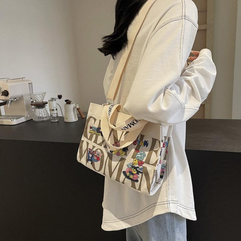 Fashion letter canvas small bag women 2025 new casual fashion messenger mobile phone bag going out tote bag simple