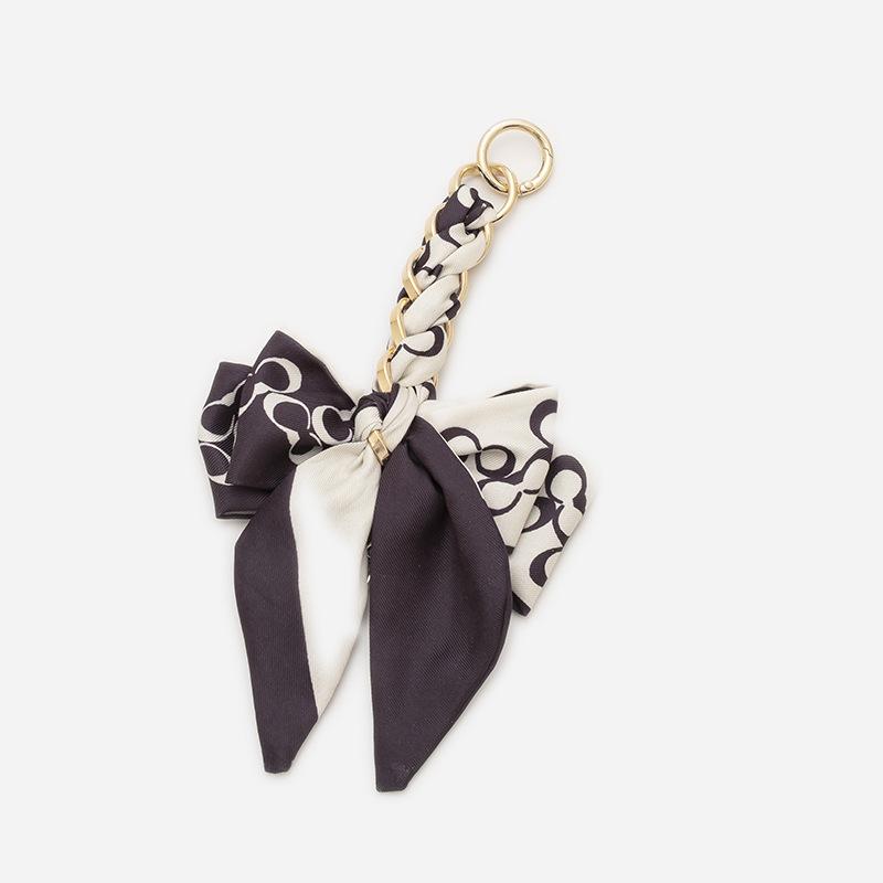 Elegant Hand-Woven Scarf Chain with Bow Decoration Pendant for Bag Strap Modification.