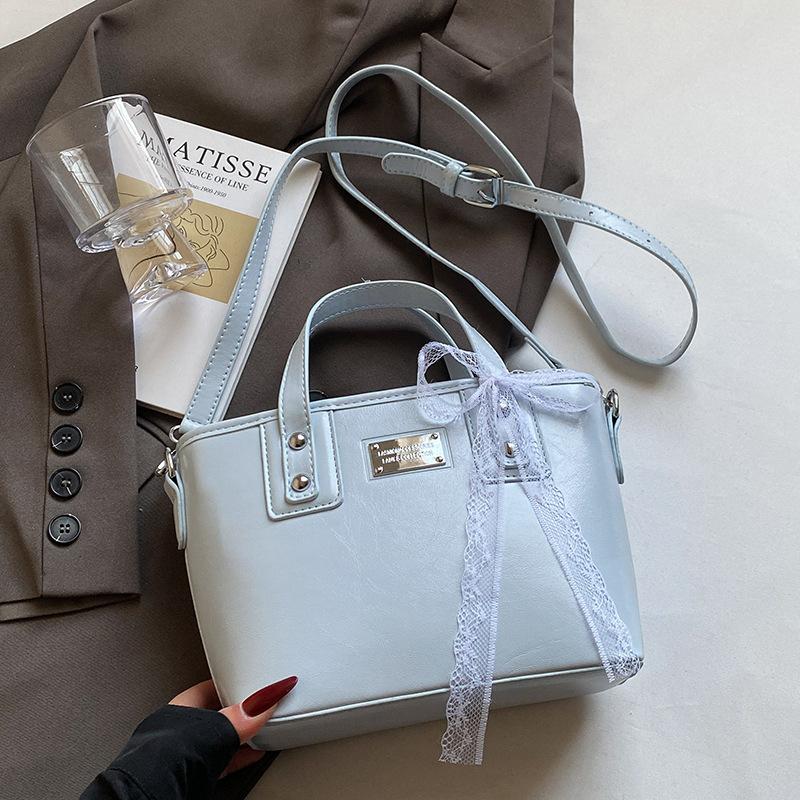 

Hot Sale Niche Casual Oil Wax Skin Simple Portable Bucket Bag Women s Commuter to Work Versatile Solid Color Messenger Bag