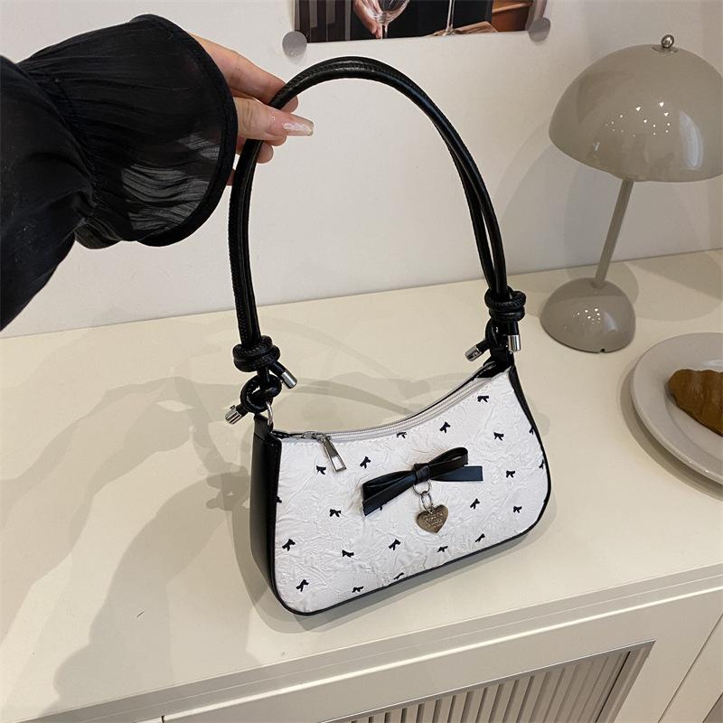Niche design bow underarm bag women's 2025 new handbag fashion shoulder messenger bag sweet baguette bag