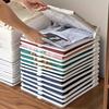 5 Stück Stapelbare Kleiderordner - Tragbare Kunststoff-Aufbewahrungsboxen für Hemden und T-Shirts mit dem Aufdruck 'Wir kommen von woanders'