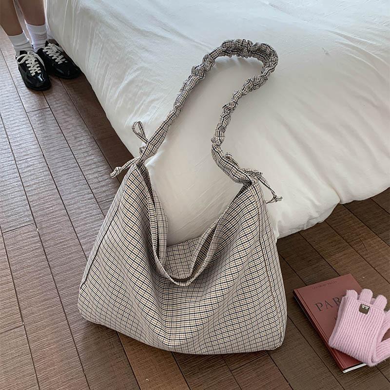 

Plaid canvas bag for women2026New artistic styleinsKorean-style commuter bag, casual crossbody bag for students attending classe хакі