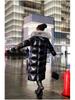 Veste en coton noir brillant longueur genou pour femme 2025 avec col en fourrure