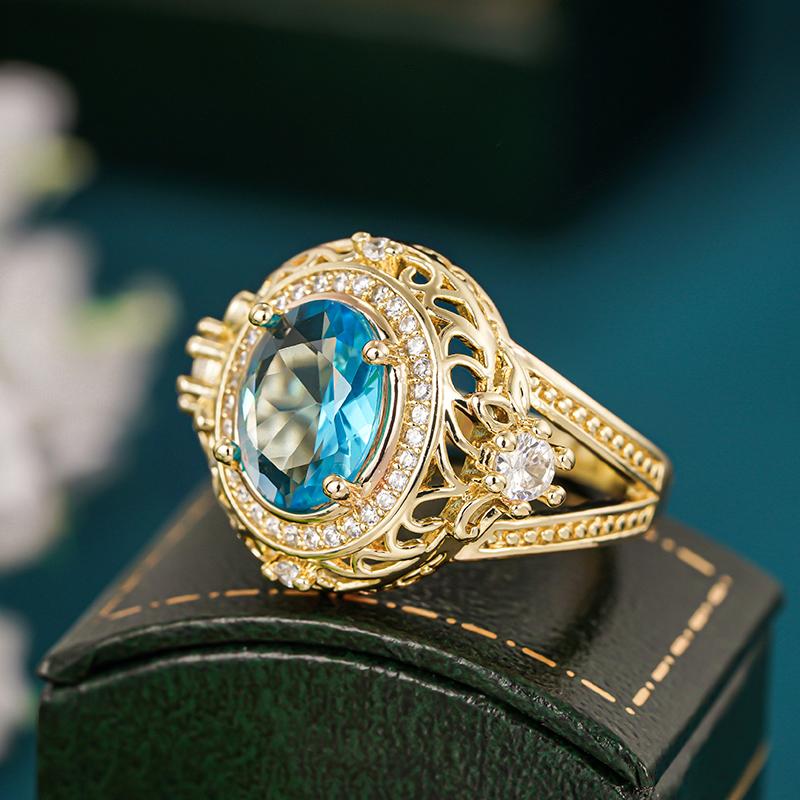 Huitan Gorgeous Women Rings with Oval Blue Cubic Zirconia Hollow Out Gold Wedding Band Accessories Lady Jewelry for Party