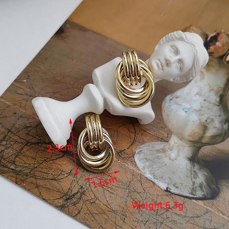 New Exaggerated Twist Metal Dangle Earrings for Women Gold Color Punk Fashion Female Hanging Earrings Boho Geometry Ear Zircon
