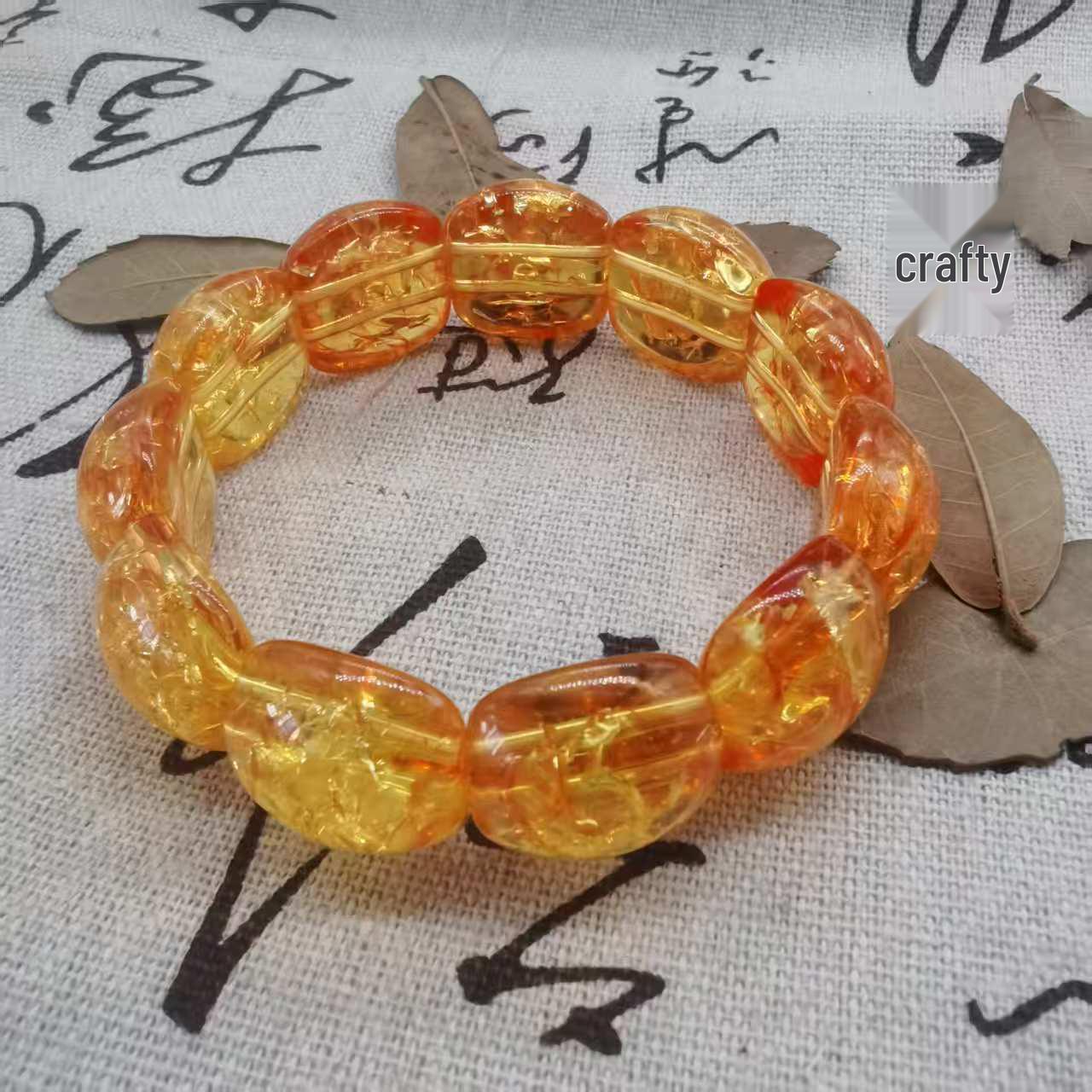 

Ethnic Style Amber Acrylic Flower Bracelet: Semi-Circular Hand-Strung Design for Men and Women.