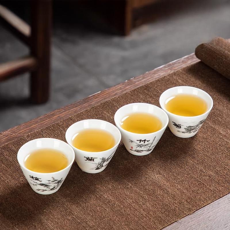 

4pcs Ceramic Chinese Plum Blossom Tea Cup Orchid Kung Fu Tea Set Underglaze Colored Tea Cup Small Capacity Drinking Utensils 5.5x4cm 40ml