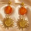 Vintage European Gold Sun Face Pendant Earrings with Amber Glass Tassel