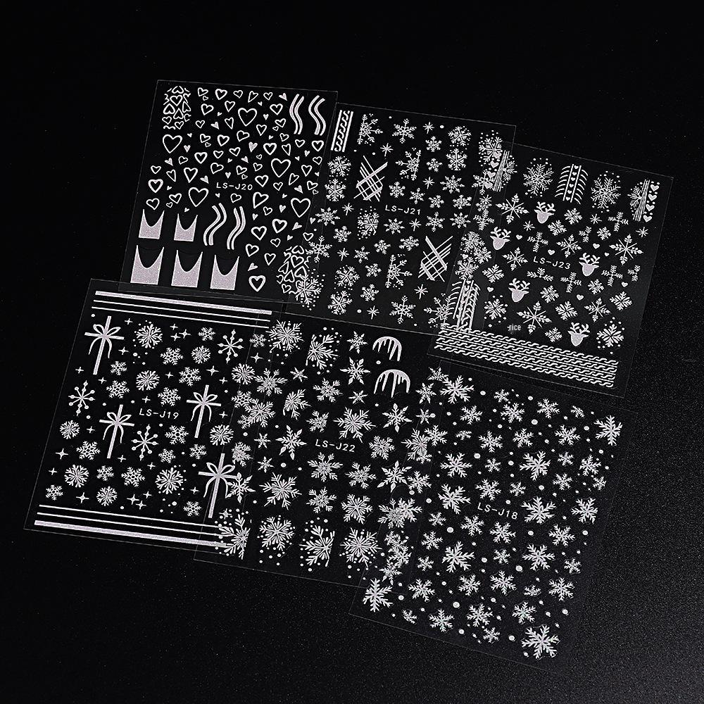 Winterweiße Weihnachts-Nagelsticker: Glitzernde Schneeflocken-, Herz- und Rentierdesigns
