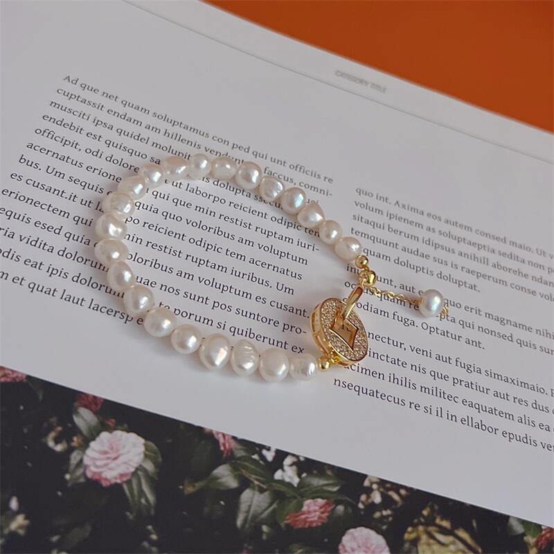 Yuhé Pearl Baroque Bracelet, a brand-new design featuring a money clip for attracting wealth14k Gold-plated for color retention, featuring a unique
