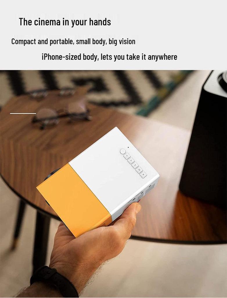 Best-Selling YG300 Yellow-White Mini Portable Projector with Mobile Screen Mirroring for Home Entertainment.