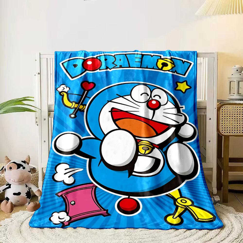 A cheerful blue robotic cat with props on a vibrant radial blue background. for all seasons blanket lunch break throw gift 80cm x 120cm