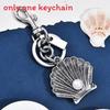 Vintage Shell Artificial Pearl Keychain With Metal Antique Finish For Bags And Car Keys