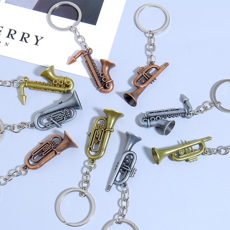 Winziger Saxophon-förmiger Schlüsselanhänger Hochwertige Metallkonstruktion Tolles Geschenk für einen Freund Saxophon-Schlüsselanhänger Taschenanhänger