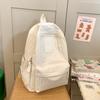 Fashion travel lightweight middle school college students class solid color backpack 2025 new simple niche design school bag