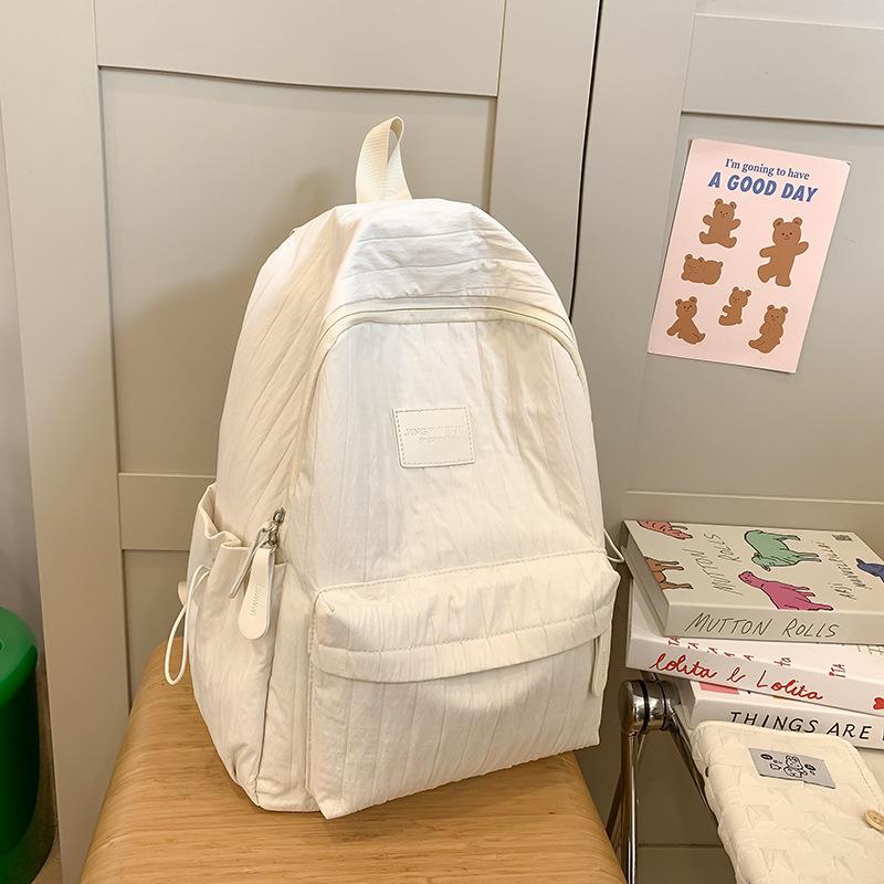 Fashion travel lightweight middle school college students class solid color backpack 2025 new simple niche design school bag