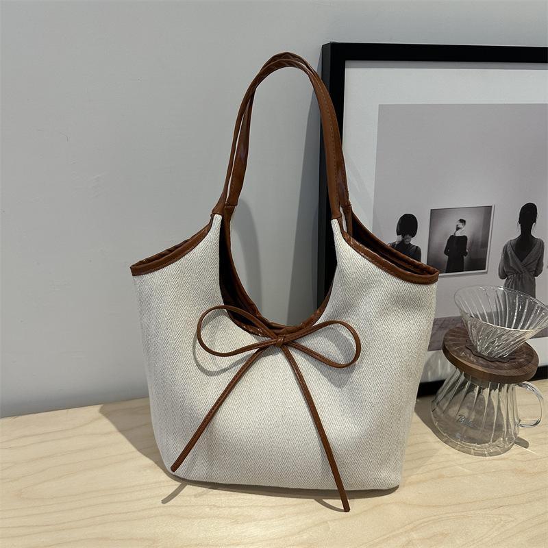 

Повседневная сумка из льна большой вместимости для поездок на работу, женская новинка 2025 с бантом, универсальная сумка через плечо в иностранном стиле, портативный держатель