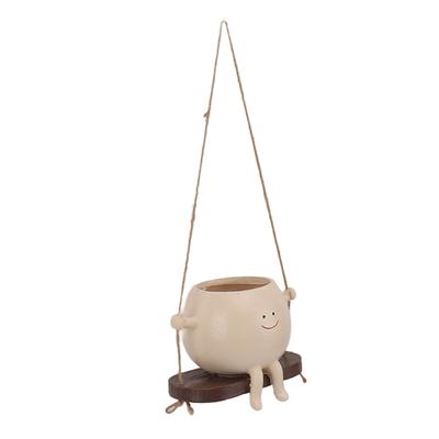 Květináč s tváří na houpačce, Pryskyřice   Květináč s tváří   Květináče, Květináče pro rostlinu Řetěz perel, Závěsná pryskyřice Květinová hlava Plante