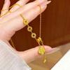 Four-Leaf Clover Necklace with Tassel: Gold and Sand Finish, Clavicle Length, Sparkling Crushed Ice Design.