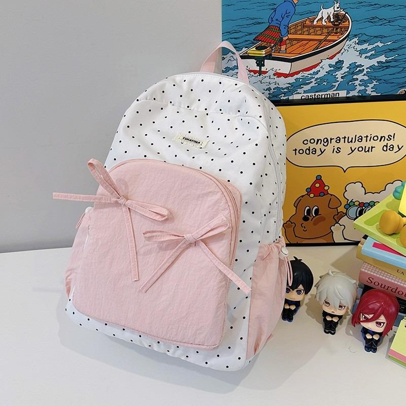 The new schoolbag is high-value, fresh and sweet, candy-colored polka dot bow backpack, junior high school backpack.